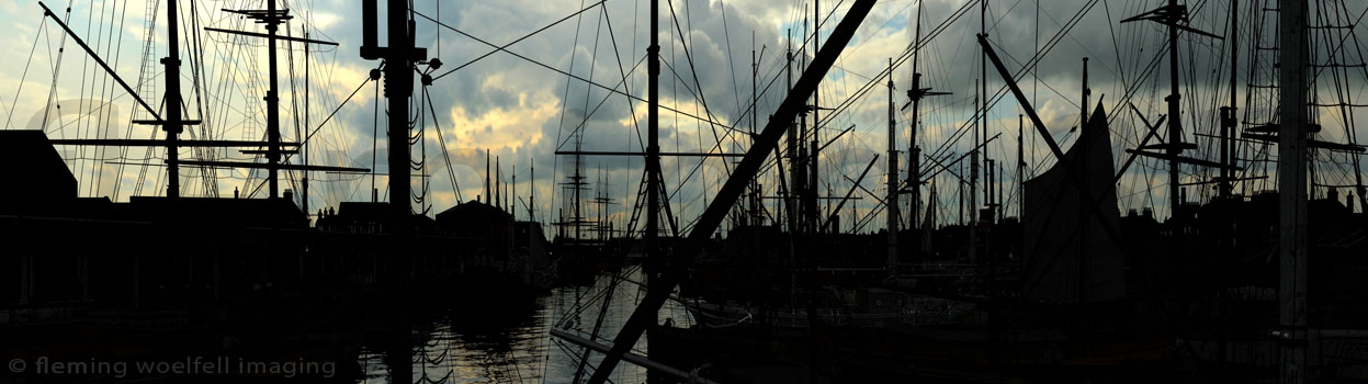 Sailing ships in dock.